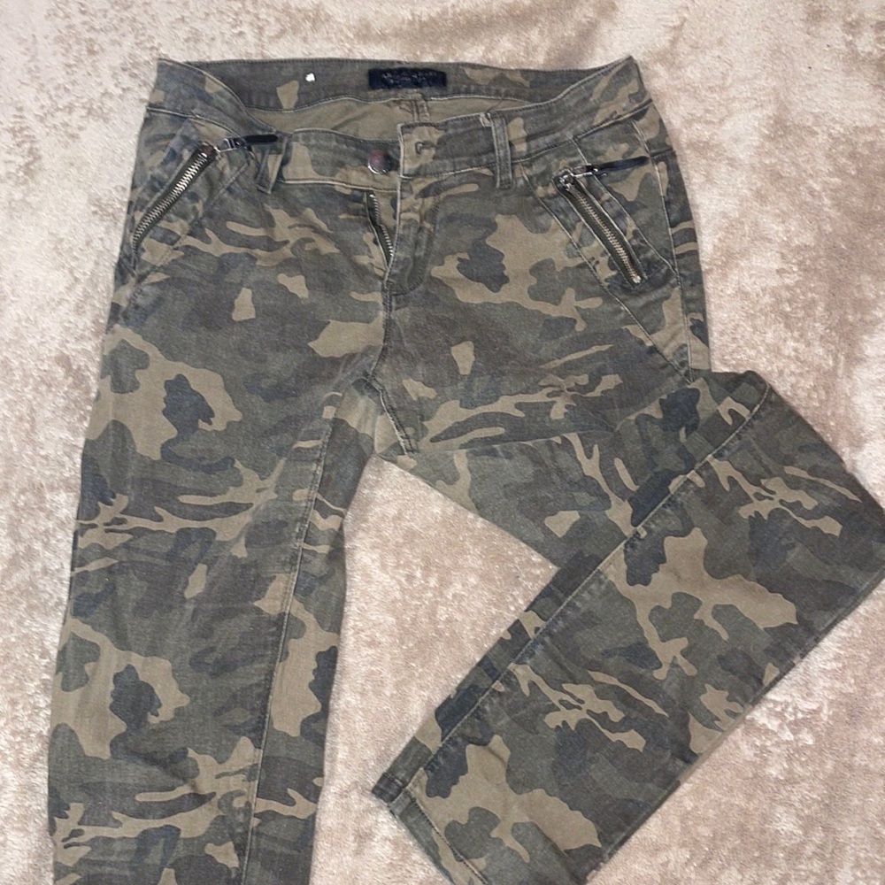 Distressed camo jeans
